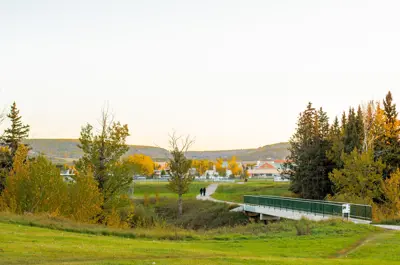 Photo of bridge and field with baseball diamond in the background