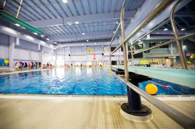 Photo of a diving board and a lane swimming pool