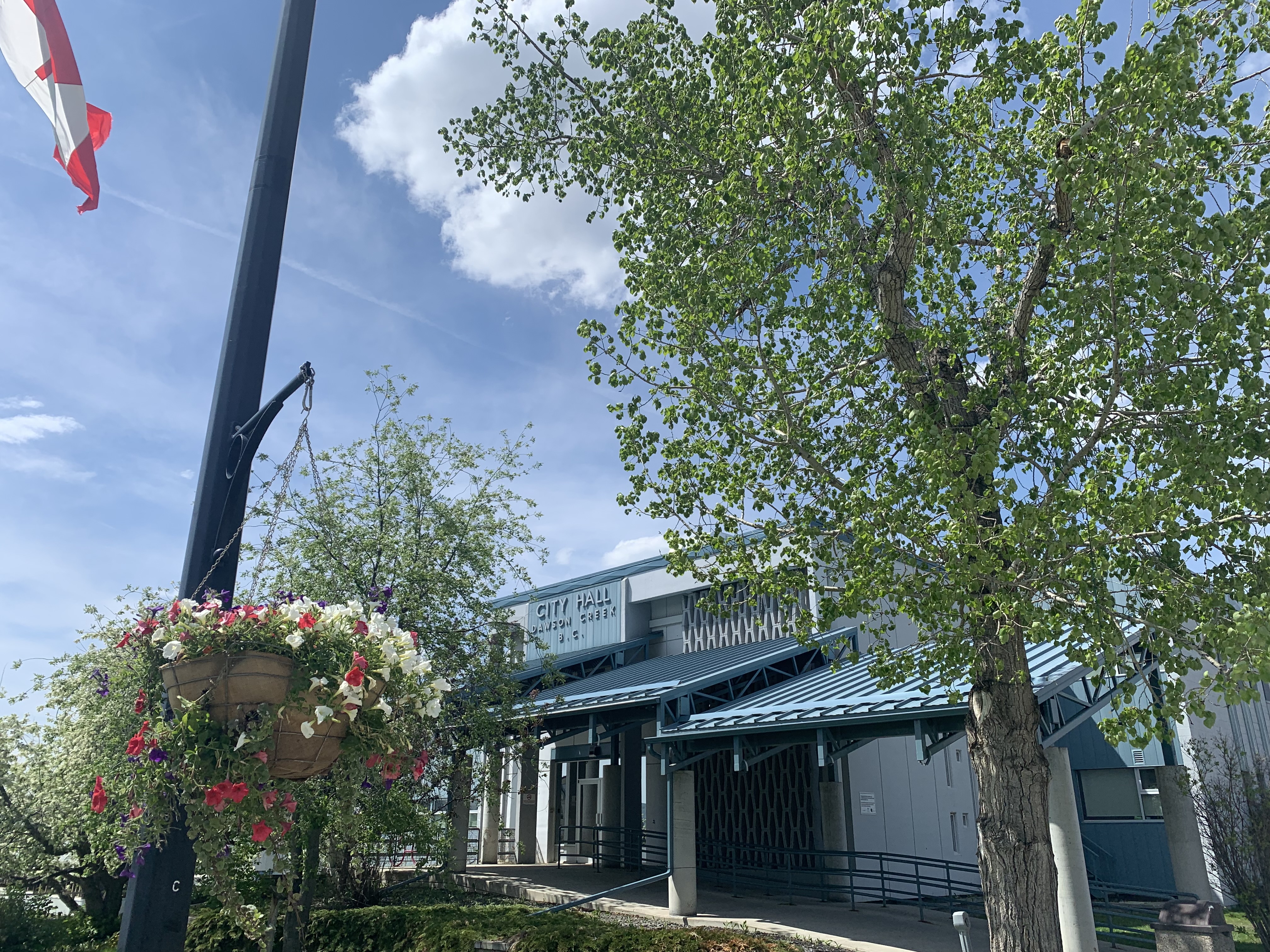 Photo of a blue building with the letters "city hall" across the top